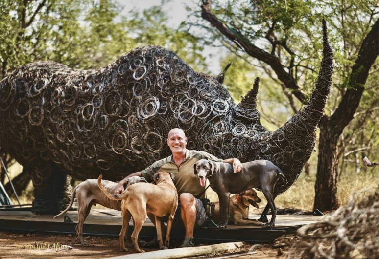 Conservation artist Conraad de Rosner with the Snare Rhino sculpture